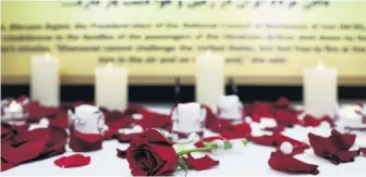  ?? PHOTOS: REUTERS ?? Floral tribute . . . Roses rest in front of a memorial for plane crash victims of Ukraine Internatio­nal Airlines Flight 752 at the California Convention for a Free Iran in Los Angeles earlier this week.