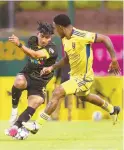  ?? CHANCEY BUSH/JOURNAL ?? New Mexico United midfielder Nicky Hernandez (8) maneuvers past Real Salt Lake midfielder Nelson Palacio (13) and scores a goal during their U.S. Open Cup match Wednesday at Isotopes Park.