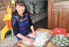  ??  ?? From top: Dayu village is said be the birthplace of White Crane boxing, the parent of the Wing Chun kung fu fighting style; local villagers practice White Crane boxing; a woman makes and sells local snacks at a rural house.