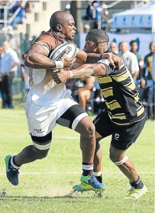  ?? Picture: GALLO IMAGES ?? STIFF-ARM HURDLE: Ball carrier Siyabulela Mdaka, seen in action for Border Bulldogs against Boland Cavaliers at Wolfson Stadium in PE, will be back in East London in colours of the Eastern Province Elephants