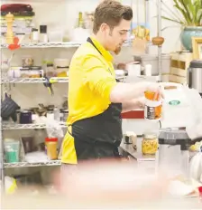  ?? OWEN WOYTOWICH ?? A chef works on the menu at The Heart of Riversdale, located at Soul Foods on 20th Street West.