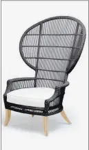 ?? COURTESY MADE GOODS ?? The Elizabetha­n-style Aurora chair from Made Goods has a metal base, faux rattan straps, teak legs and weatherpro­of fabric.