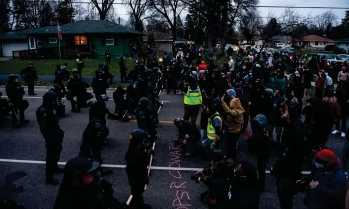  ?? Photograph: Stephen Maturen/Getty Images ?? Protesters face off with police in Brooklyn Center, Minnesota.