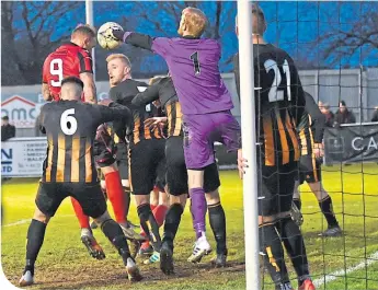  ??  ?? Huntly defend their goalmouth against Inverurie
