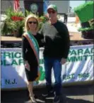  ??  ?? Hamilton Mayor Kelly Yaede (left) serves as grand marshal of the 2018 Hamilton St. Patrick’s Day Parade as Hamilton Police Chief James Collins enjoys his last parade before retiring from the force.