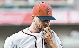  ?? NICK WASS/AP ?? Nationals reliever Blake Treinen makes his way back to the dugout after the Cubs rallied against him to score three runs in the ninth inning Thursday in Washington. Stress relief :