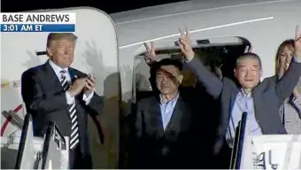  ??  ?? Donald and Melania Trump applaud as the first of the recently freed Korean Americans leave the plane that carried them home from North Korea.