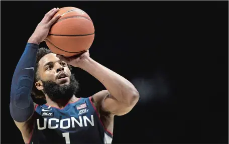  ?? ALBERT CESARE/THE CINCINNATI ENQUIRER VIA AP ?? UConn guard R.J. Cole hits a free throw in the final seconds to help clinch Saturday’s 80-72 Big East Conference win over Xavier in Cincinnati. Cole finished with 24 points, including five 3-pointers, and seven assists.