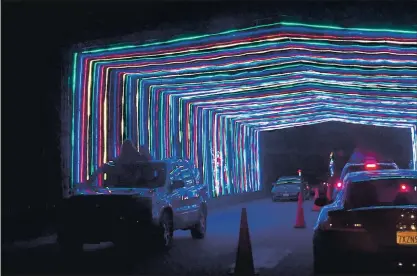  ?? PHOTOS FROM BANG ARCHIVES ?? Vehicles, some with people standing up through the sunroof, drive through Vasona Lake County Park in 2017 for the annual Fantasy of Lights display. This year’s event, which starts Friday, already has sold all of its tickets for shows that run through Dec. 30.