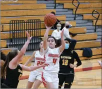  ?? CHRIS BOLLINGER - FOR THE NEWS-HERALD ?? Carmen Cicerini of Hawken hits a floater in the Hawks’ win over Beachwood. Hawken has won 10 in a row and is undefeated in CVC Chagrin Division play.