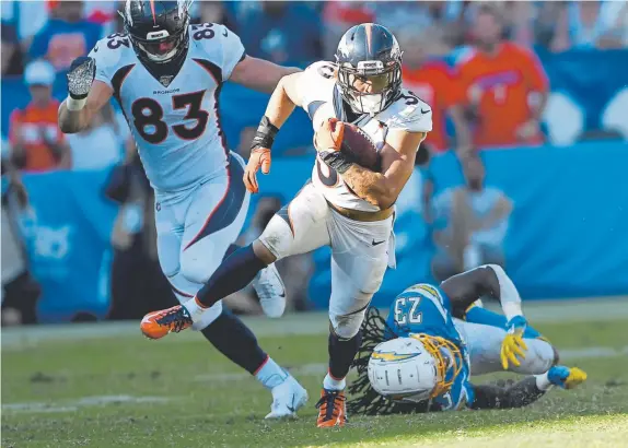  ?? Joe Amon, The Denver Post ?? Broncos running back Phillip Lindsay breaks out for a 32-yard gain in Denver’s 20-13 win over the Los Angeles Chargers on Sunday.