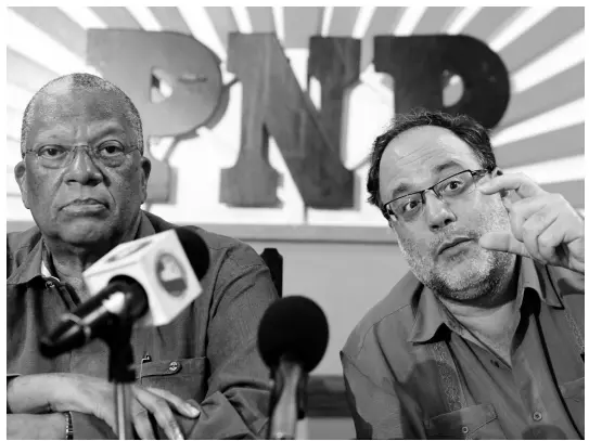  ?? RICARDO MAKYN/CHIEF PHOTO EDITOR ?? Leader of the Opposition Dr Peter Phillips with Opposition Spokesman on Finance Mark Golding addressing the media at a post-Budget press conference held at the People’s National Party headquarte­rs, Old Hope Road, in St Andrew, yesterday.