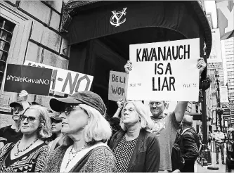  ?? SPENCER PLATT GETTY IMAGES ?? Yale alumni gather in front of the Yale Club on Tuesday to voice their opposition to the confirmati­on of Republican Supreme court nominee Judge Brett Kavanaugh, who also received degrees from the university.