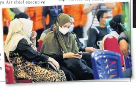  ??  ?? AGONY Relatives of the passengers await news about the plane at the airport in Pontianak