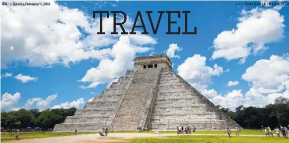  ?? PHOTOS BY ROSS D. FRANKLIN/THE ASSOCIATED PRESS ?? Tourists are dwarfed by El Castillo at the Chichen-Itza ruins in Yucatan, Mexico. • • •