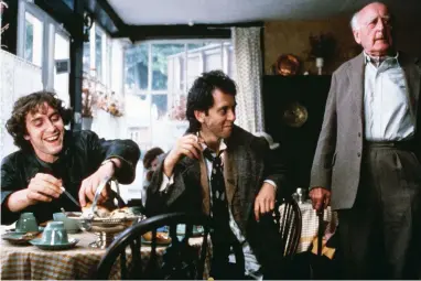  ??  ?? taking high tea The cake-demanding protagonis­ts (Paul McGann, Richard E. Grant) stress their multi-millionair­e status to Penrith Tea Rooms’ proprietor (Llewellyn Rees).