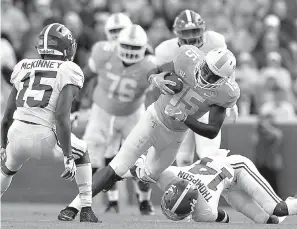  ?? Joy Kimbrough /The Daily Times via AP ?? ■ Tennessee wide receiver Jauan Jennings (15) catches a pass from Tennessee quarterbac­k Jarrett Guarantano (2) during the first half of an NCAA college football game against Alabama on Saturday in Knoxville, Tenn.