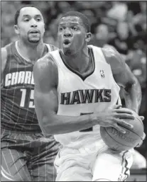  ?? AP FILE ?? Joe Johnson, right, will be traded from the Hawks to the Brooklyn Nets in a six-player deal. Johnson is a five-time All-Star and has averaged 17.8 points in 11 seasons.
