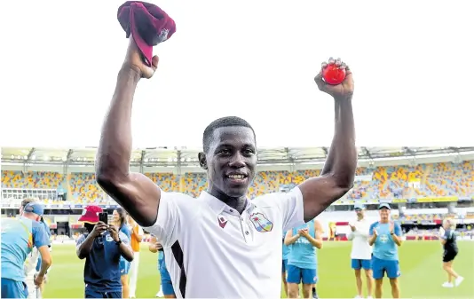  ?? AP ?? West Indies fast bowler Shamar Joseph raises the ball after taking seven wickets in his team’s eight-run win over Australia on the fourth day of the second Test in Brisbane on January 28.