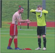  ??  ?? Graham Douglas can hardly get his gloves off to give to Steven MacLeod.