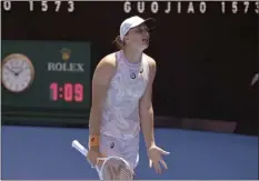 ?? AP photo ?? No. 1 Iga Swiatek reacts during her 6-4, 6-4 loss to Elena Rybakina in the Australian Open fourth round on Sunday.
