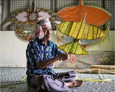  ?? — Photos: Bernama ?? Traditiona­l kite-maker Pak Non says wau kites made from palas leaves are more durable and don’t damage as easily as paper ones.