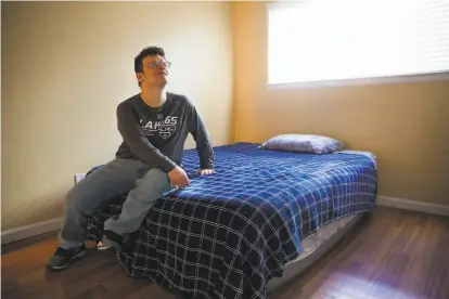  ?? Photos by Nina Riggio / Special to The Chronicle ?? Rogelio Plancarte on his inflatable mattress in the family’s twobedroom apartment in Napa. He and his parents are looking for a larger place after losing their home in St. Helena to the Glass Fire, which destroyed 1,555 buildings.