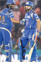  ??  ?? Mumbai Indians batsman Ambati Rayudu (L) congratula­tes teammate Parthiv Patel as he celebrates after scoring a half-century during the Twenty20 cricket match against Kings XI Punjab at The Punjab Cricket Associatio­n Stadium in Mohali on Monday.