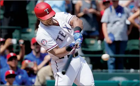  ?? AP/TONY GUTIERREZ ?? Texas Rangers third baseman Adrian Beltre hits a double off Baltimore Orioles starting pitcher Wade Miley in the fourth inning Sunday in Arlington, Texas, for his 3,000th career hit. Beltre became the 31st player in major league history to record at...