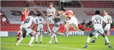  ??  ?? Charlton Athletic’s Jayden Stockley (third right) leaves the Burton Albion defence helpless as he heads in his side’s early goal in the match at The Valley.