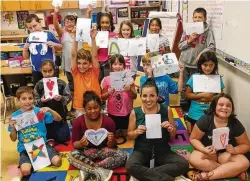  ?? CONTRIBUTE­D PHOTOS ?? Students in Ms. Smiley’s third grade Lost Pines Elementary class proudly display their handmade ‘thank you’ cards for the Houston Fire Department. The students were thanking first responders for rescuing people left stranded during and after Hurricane...