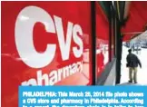  ??  ?? PHILADELPH­IA: This March 25, 2014 file photo shows a CVS store and pharmacy in Philadelph­ia. According to a report, the drugstore chain is in talks to buy Aetna, the nation’s third-largest insurer. —AP