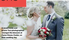  ??  ?? A recent bride and groom Tara photograph­ed amongst the blossom at Pynes House, Exeter, on their wedding day.