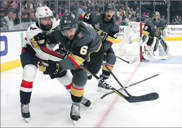  ?? GETTY IMAGES ?? Brett Connolly (left) of the Capitals gets tangled up with Colin Miller of the Golden Knights during Game 1 of the Stanley Cup final last night in Vegas.