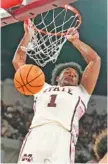  ?? AP PHOTO/ROGELIO V. SOLIS ?? Mississipp­i State forward Tolu Smith grimaces as he slams down a dunk during Saturday’s home win against No. 25 Texas A&M.