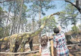  ?? CONTRIBUTE­D BY STONE MOUNTAIN PARK ?? Turn a fun trip to Stone Mountain into a fact-finding mission about dinosaurs. Dinosaur Explore in Stone Mountain Park’s Crossroads area lets visitors interact with 14 types of dinosaurs, including 20 full-size species with special effects that make...