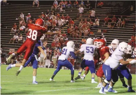  ??  ?? Malik Coleman tries to block a pass thrown by Ringgold quarterbac­k Kole Kibler. (Catoosa News photo/Misty Martin)