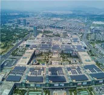  ??  ?? An aerial view of the Internatio­nal Trade Center in Yiwu, east China’s Zhejiang Province, in August 2017