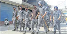  ?? ANI ?? Paramilita­ry personnel patrol a street two days after a clash between two groups in Patiala on Sunday.