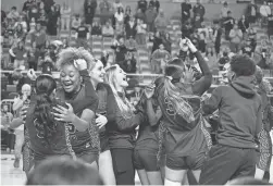  ?? MEGAN MENDOZA/THE REPUBLIC ?? The Valley Vista High School girls basketball team embraces winning the 6A girls championsh­ip at Veterans Memorial Coliseum.