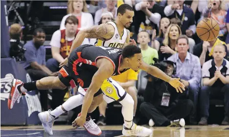  ?? DARRON CUMMINGS/THE ASSOCIATED PRESS ?? Toronto Raptors guard Kyle Lowry and Indiana Pacers guard George Hill fight for the ball in Game 4 of their playoff series in Indianapol­is on Saturday. Lowry is shooting 18 per cent on three-pointers this series, down from 39 per cent in the regular...