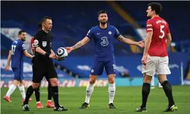  ??  ?? Stuart Attwell, Olivier Giroud and Harry Maguire after Attwell decided not to award United a penalty. Photograph: Getty Images