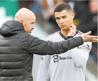  ?? Reuters-Yonhap ?? Manchester United manager Erik ten Hag talks to Cristiano Ronaldo before the start of the second half against Aston Villa at Villa Park in Birmingham, Nov. 6.