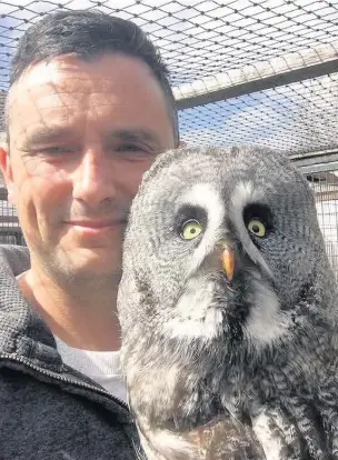  ??  ?? Jason Ashcroft with the grey owl which has been stolen