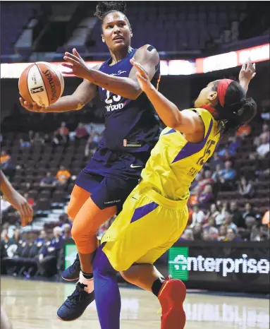  ?? Jessica Hill / Associated Press ?? Alyssa Thomas, left, of the Connecticu­t Sun drives to the basket as Allisha Gray of the Dallas Wings defends during a preseason WNBA game May 8 in Uncasville.