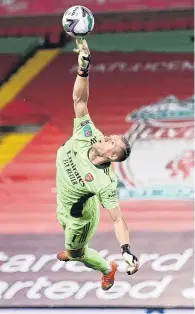  ?? PHOTO: REUTERS ?? One Leno aleaping . . . Arsenal's Bernd Leno makes a save during his team’s English League Cup fourth round match against Liverpool at Anfield yesterday.