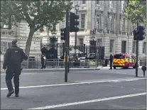  ?? BEN HATTON — PA VIA AP ?? Police say a car has collided with the gates of Downing Street in central London, where the British prime minister's home and offices are located.