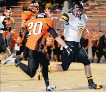  ?? COURTESY PHOTO ?? Nick Sugg fights off a Gravette tackle with a stiff-arm. Sugg ran for two touchdowns as the Tigers beat the Lions, 28-7, on Friday to claim their second consecutiv­e conference crown.