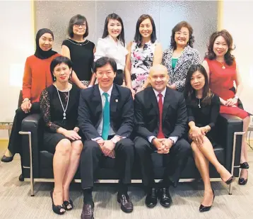  ??  ?? The senior ladies at OCBC Bank together with Ong (seated, second left) and OCBC Al-Amin chief executive officer, Syed Abdull Aziz Syed Kechik (seated, second right).