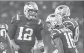  ?? ELISE AMENDOLA/AP ?? Patriots quarterbac­k Tom Brady shouts toward receivers Jakobi Meyers, center, and Ryan Izzo, right, during Thursday night’s game against the Giants.